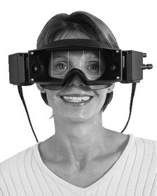 Smiling woman wearing vestibular testing goggles
