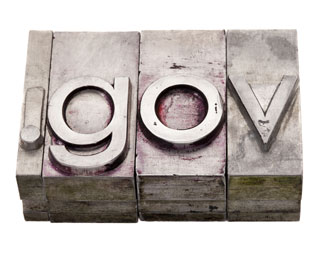 The letters .gov in vintage stained metal letterpress printing blocks