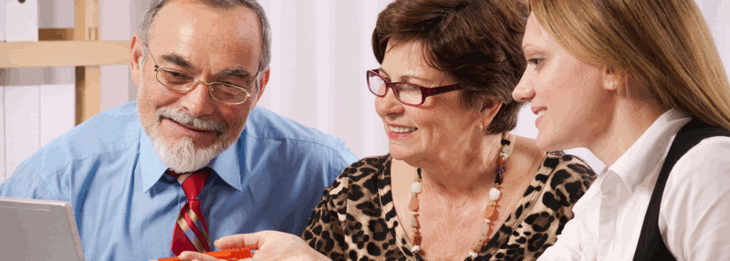 An elderly couple in consultation with an Audiologist